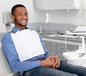 Smiling man sitting in dentist's office